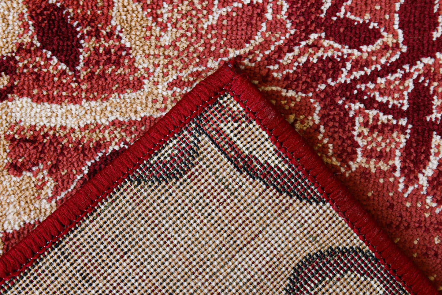 Detaliu material covor modern floral grena