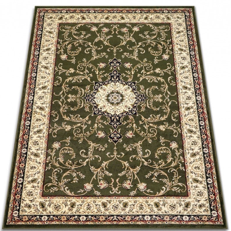 Detaliu medalion ornamental pe covor clasic verde