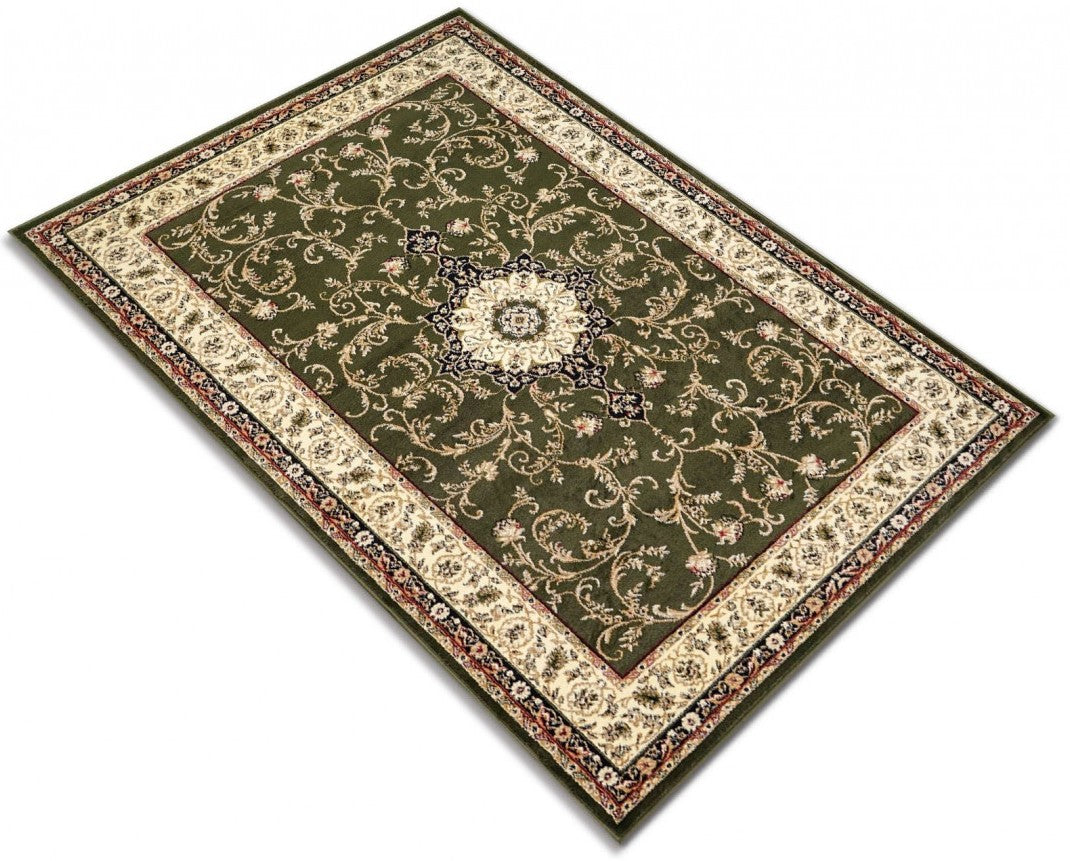 Detaliu model floral pe covor clasic verde