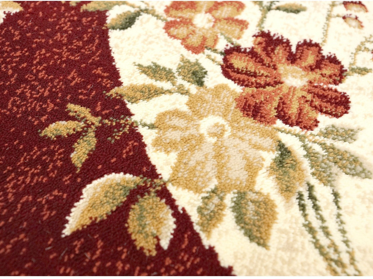 detaliu model floral covor modern oval crem cu grena