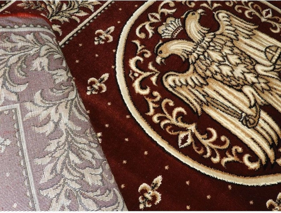 Detaliu ornamental cu vultur bicefal pe covor bisericesc oval grena